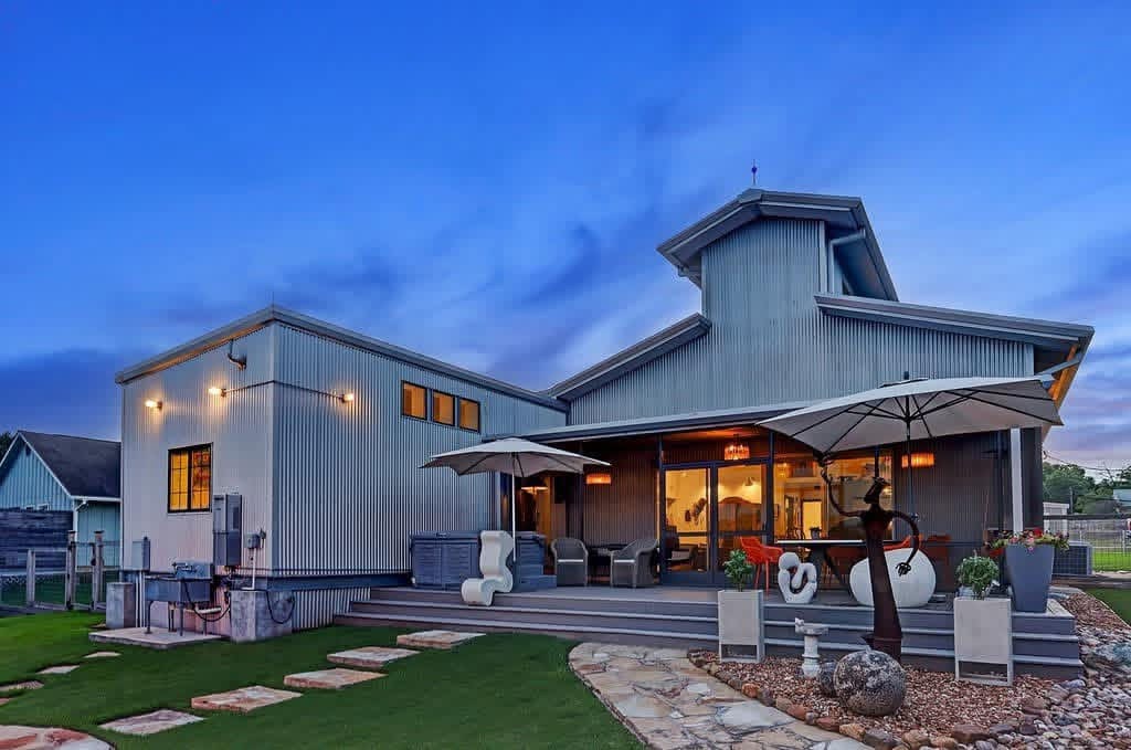 Modern metal home with cedar accents at dusk